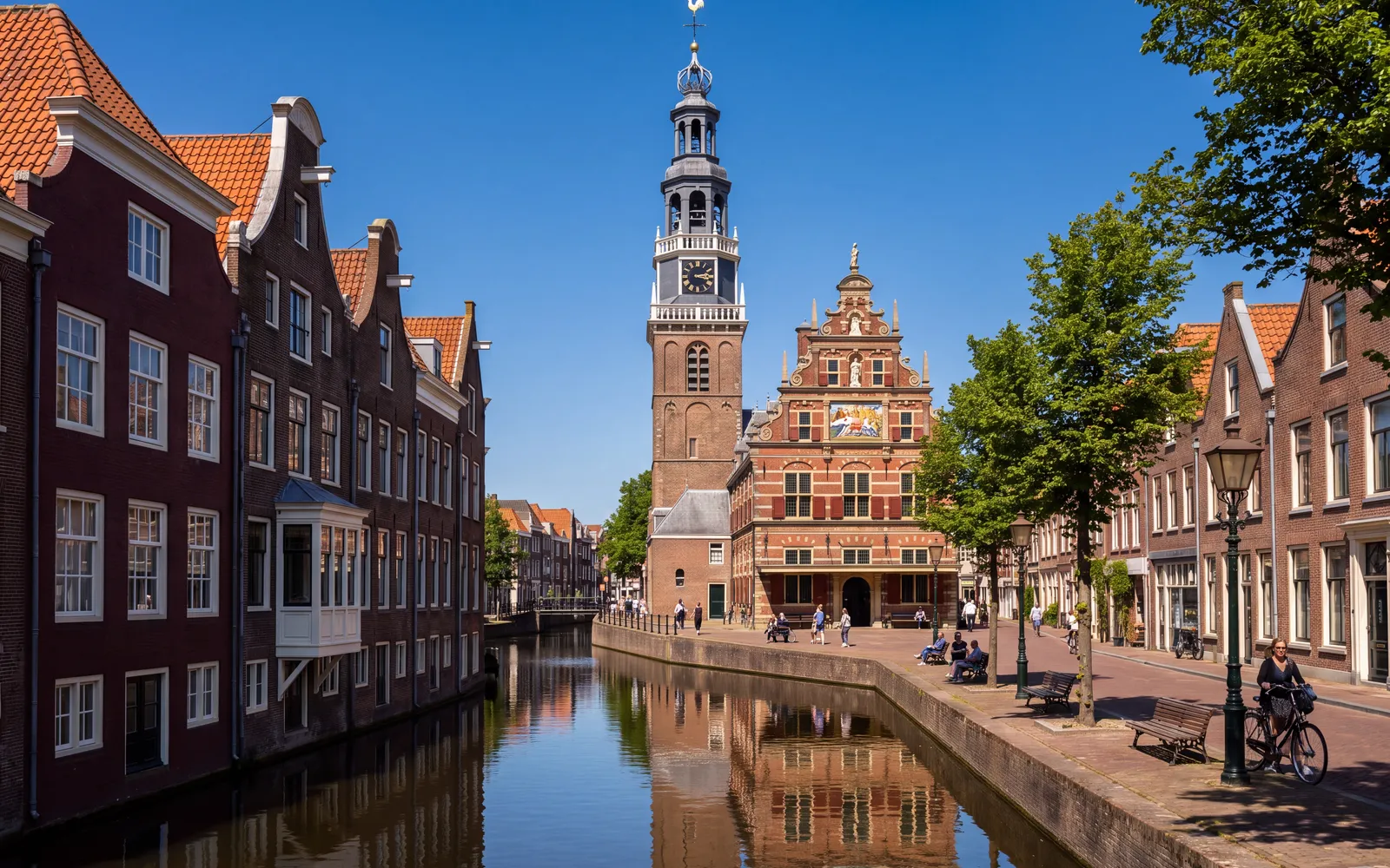 The Waag weigh house in Alkmaar with its tower, seen over the canal from Luttik Oudorp