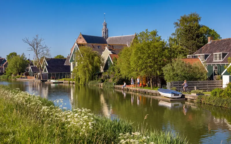 The Grote Kerk of Oosthuizen above the wooden houses along the Beemster ring canal