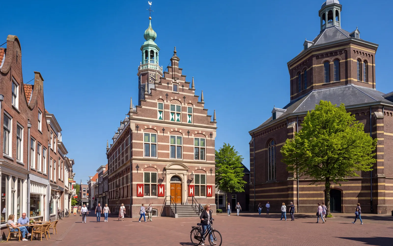 The old town hall on the Kaasmarkt in Purmerend, with the domed Koepelkerk on the right