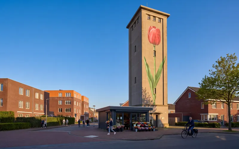 The water tower with its red tulip in Roelofarendsveen under a blue sky