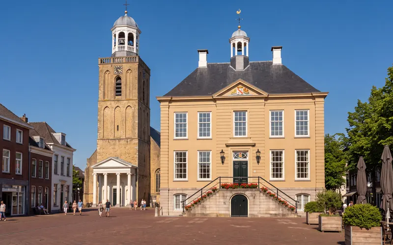 The old town hall on the Markt in Roosendaal, with the tower of St John's Church beside it