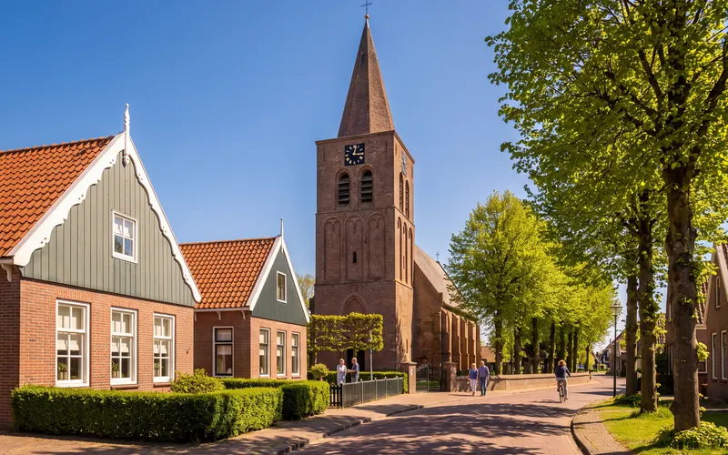 The Kerkbuurt in Uitgeest with the medieval tower of the village church